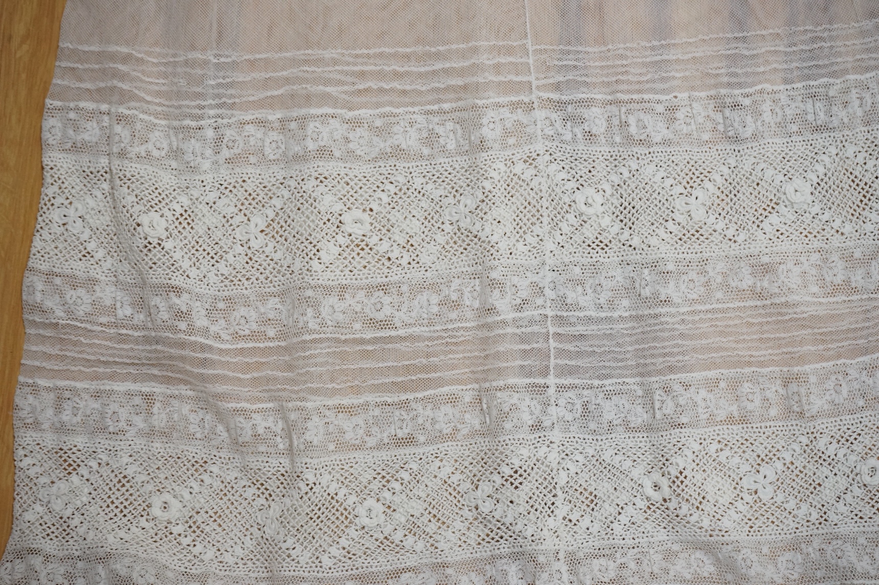 A collection Victorian textiles to include a lace christening gown, Irish crochet and a net baby gown